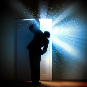 Image of young businessman standing with back opening door-1-237346-edited.jpeg